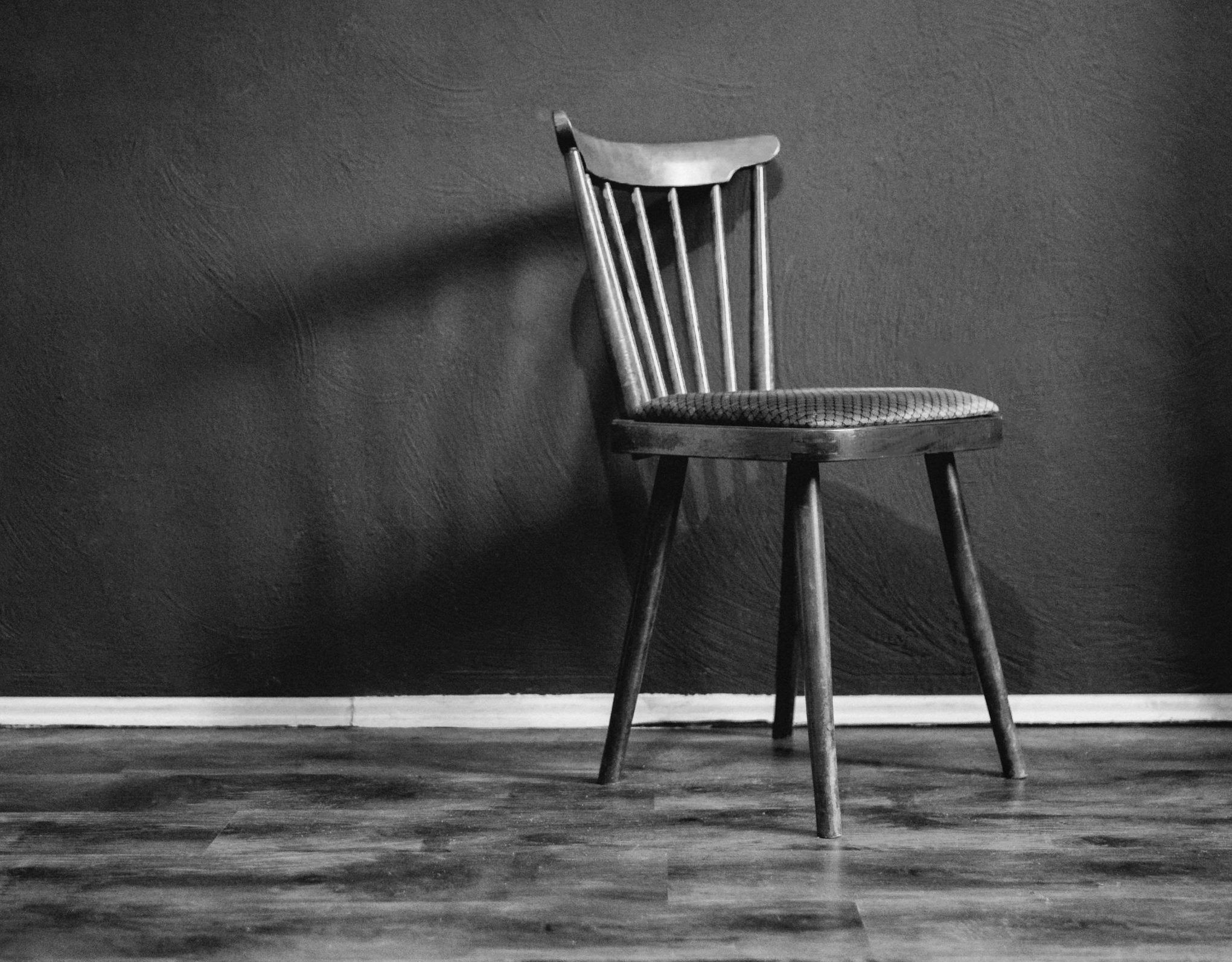 grayscale photo of wooden chair